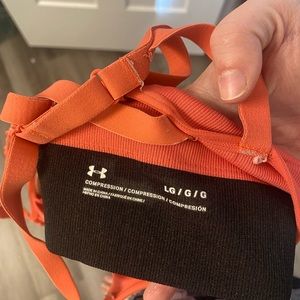 Under Armour women’s Large sports bra. Worn a few times. Pink/coral color